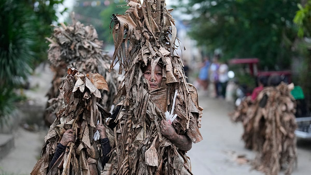 Catholics walk barefoot in mud ritual